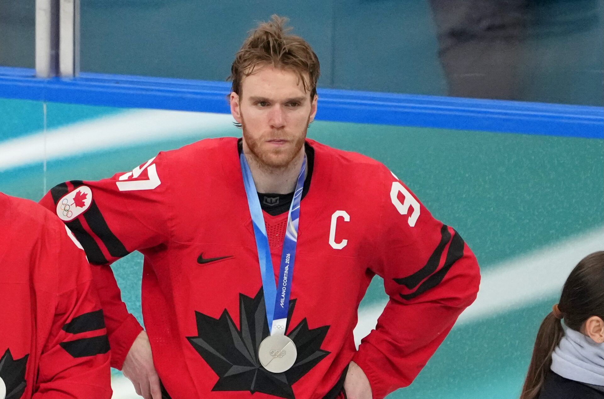 Connor McDavid of Canada react after losing to the United States in the men's ice hockey gold medal game during the Milano Cortina 2026 Olympic Winter Games at Milano Santagiulia Ice Hockey Arena.