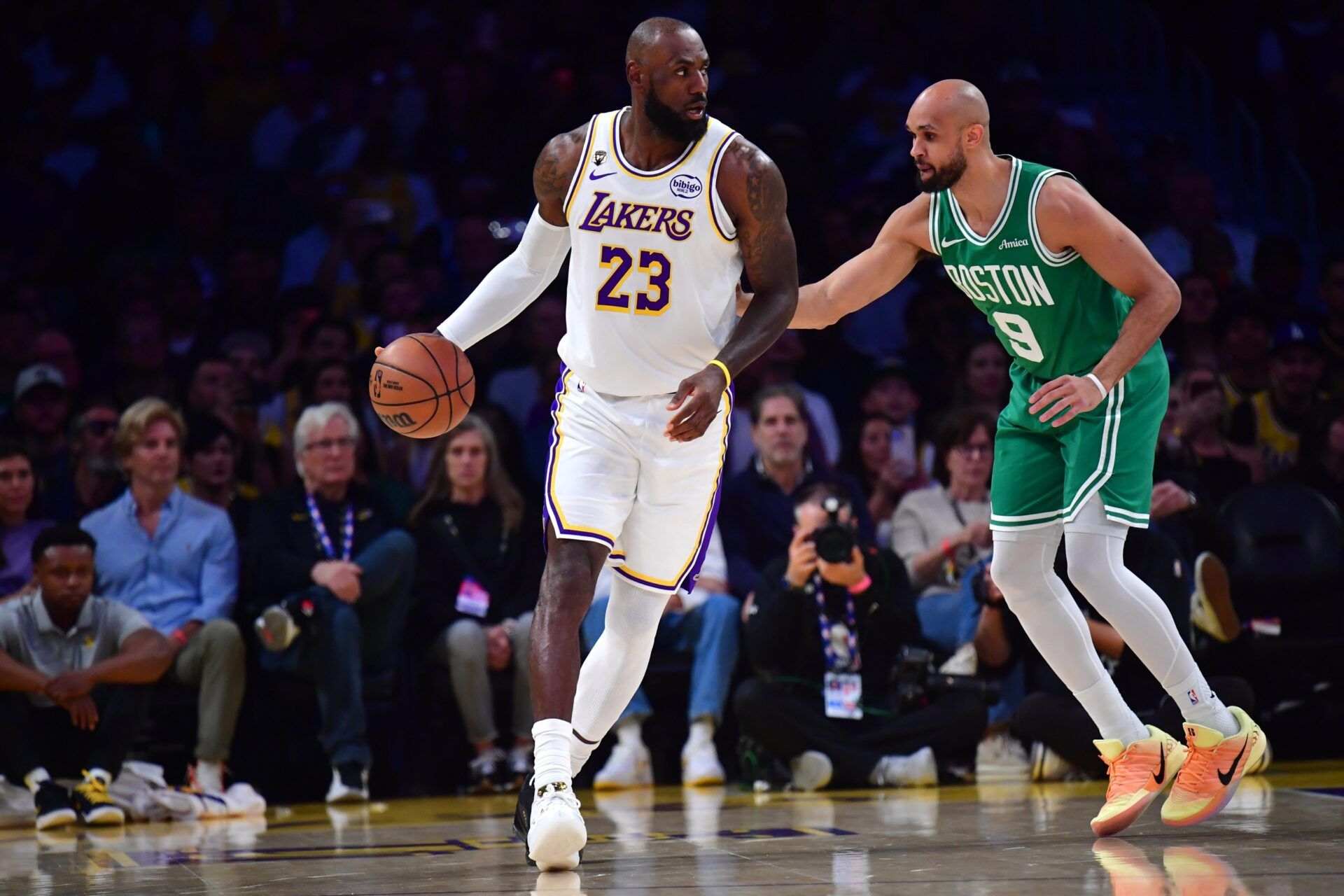 Los Angeles Lakers forward LeBron James (23) moves the ball against Boston Celtics guard Derrick White (9) during the first half at Crypto.com Arena.