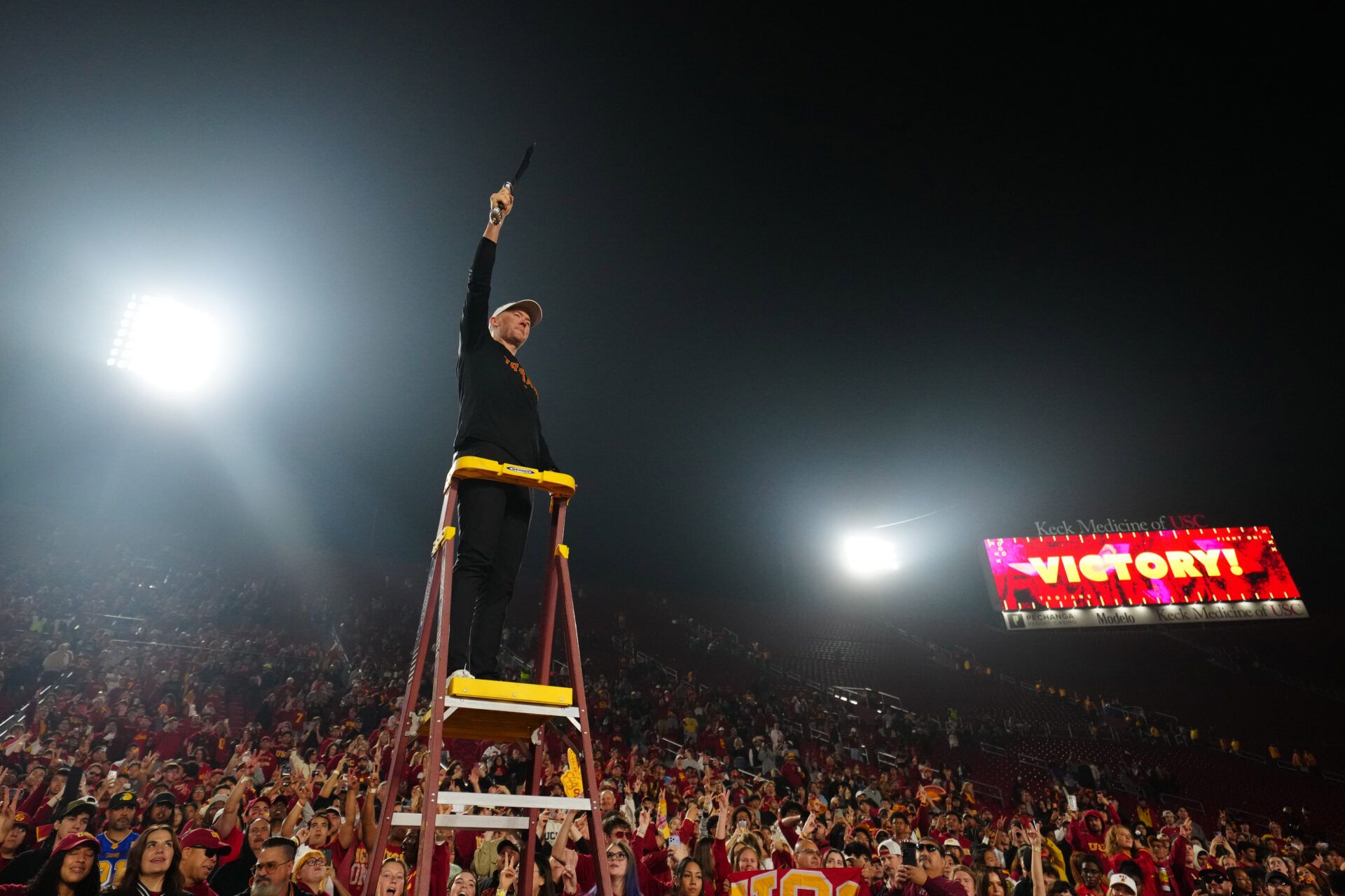 Southern California Trojans head coach Lincoln Riley leads the Spirit of Troy marching band in a rendition of Tribute to Troy after teh game against the UCLA Bruins at United Airlines Field at Los Angeles Memorial Coliseum.