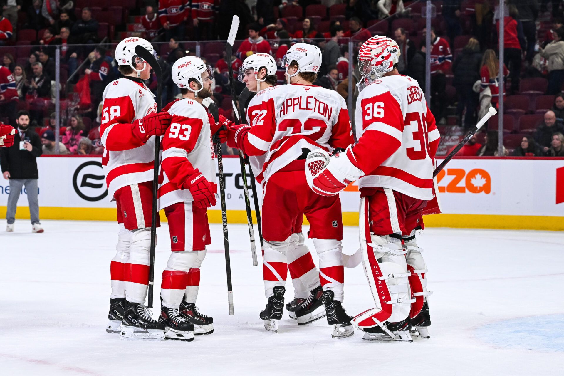 Detroit Red Wings players gather to celebrate the win at Bell Centre.