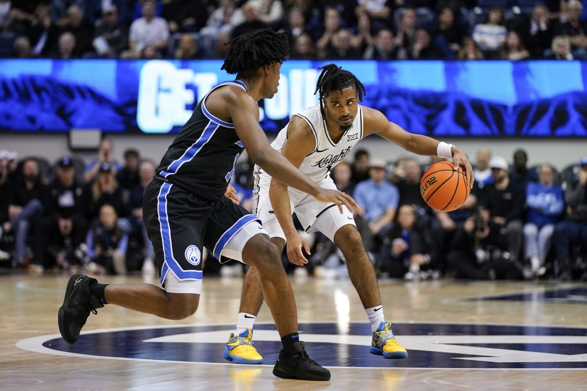 UCF Knights guard Themus Fulks (1) controls the ball during the second half against the BYU Cougars at Marriott Center.