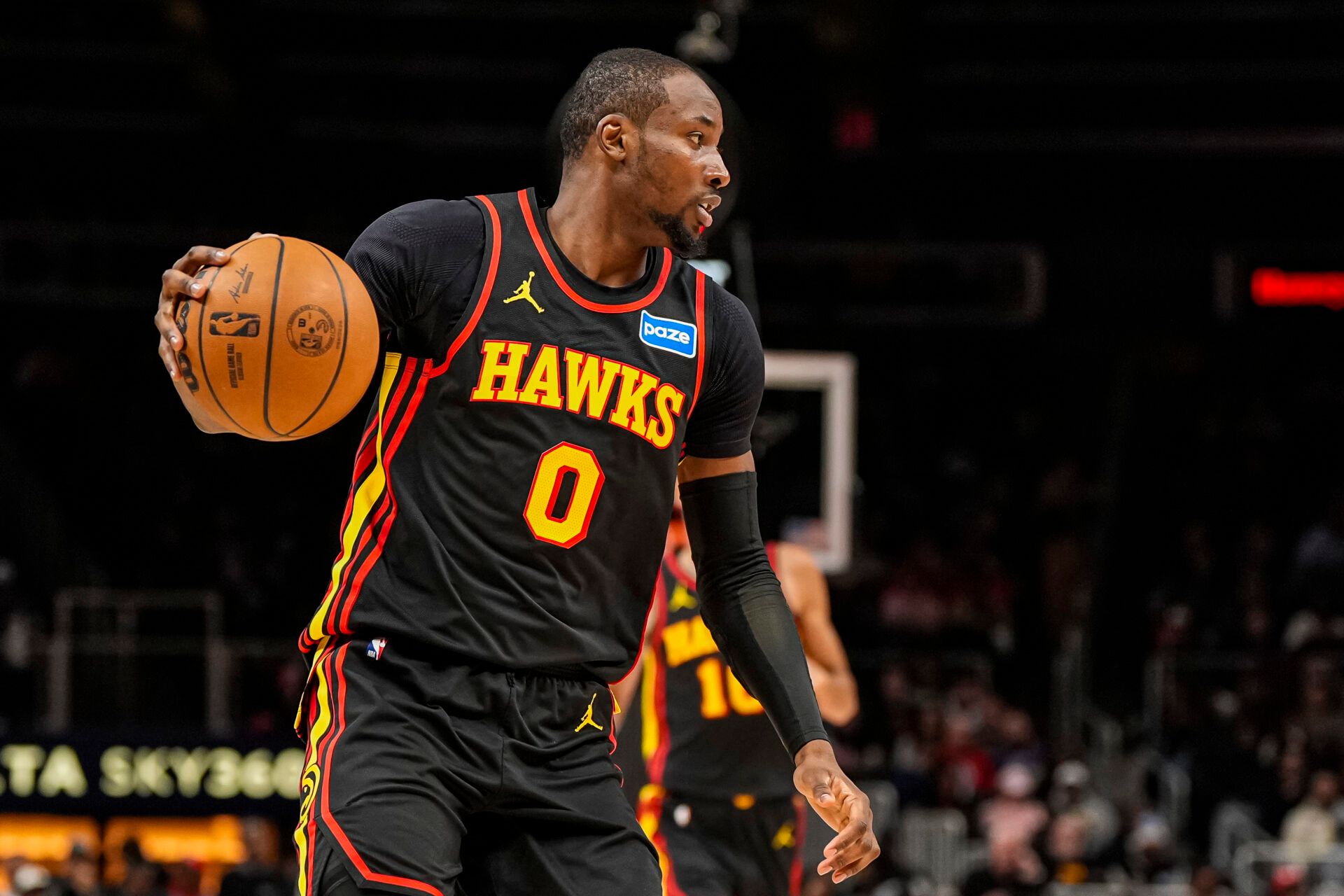 Atlanta Hawks forward Jonathan Kuminga (0) controls the ball against the Washington Wizards during the second half at State Farm Arena.