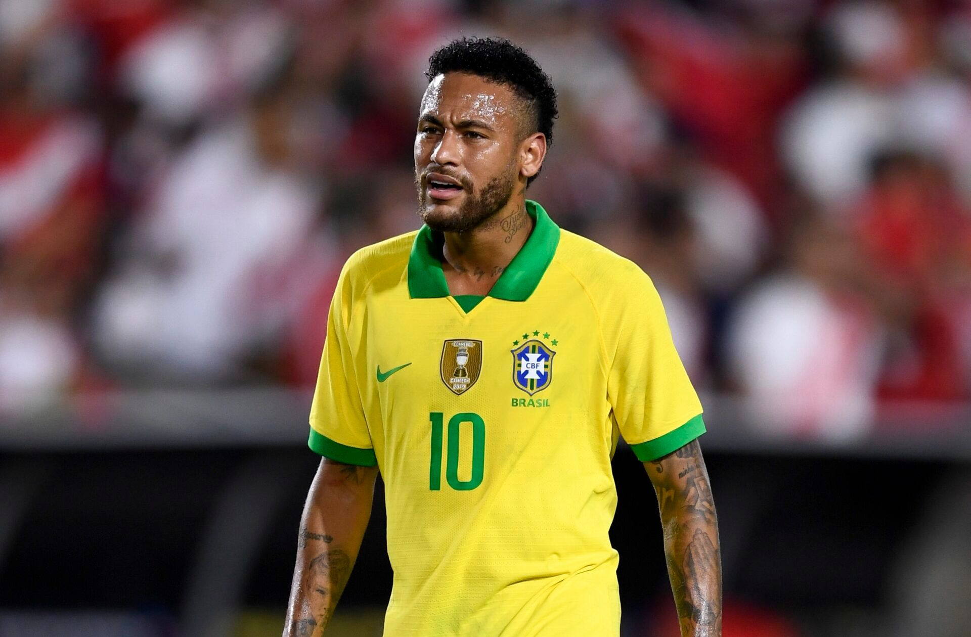 Brazil forward Neymar (10) looks on after the South American Showdown soccer match against Peru at Los Angeles Coliseum.