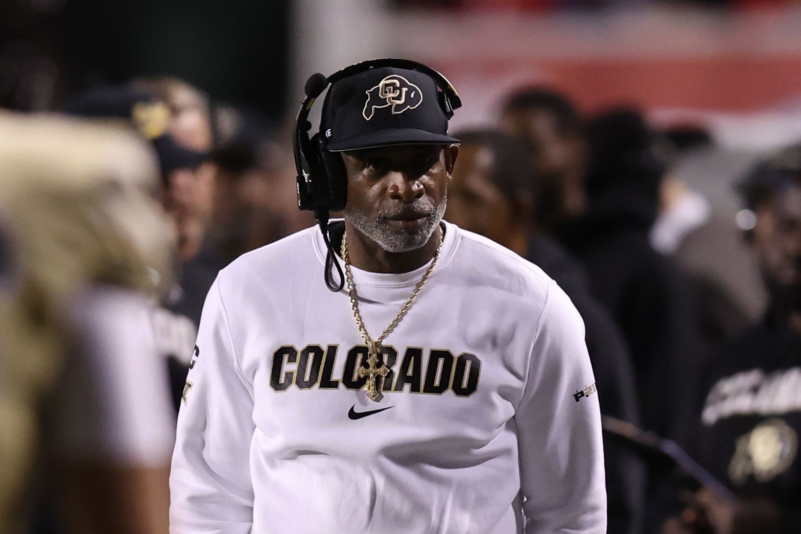 Colorado Buffaloes head coach Deion Sanders looks on during a time out in the game against the Utah Utes during the second quarter at Rice-Eccles Stadium.