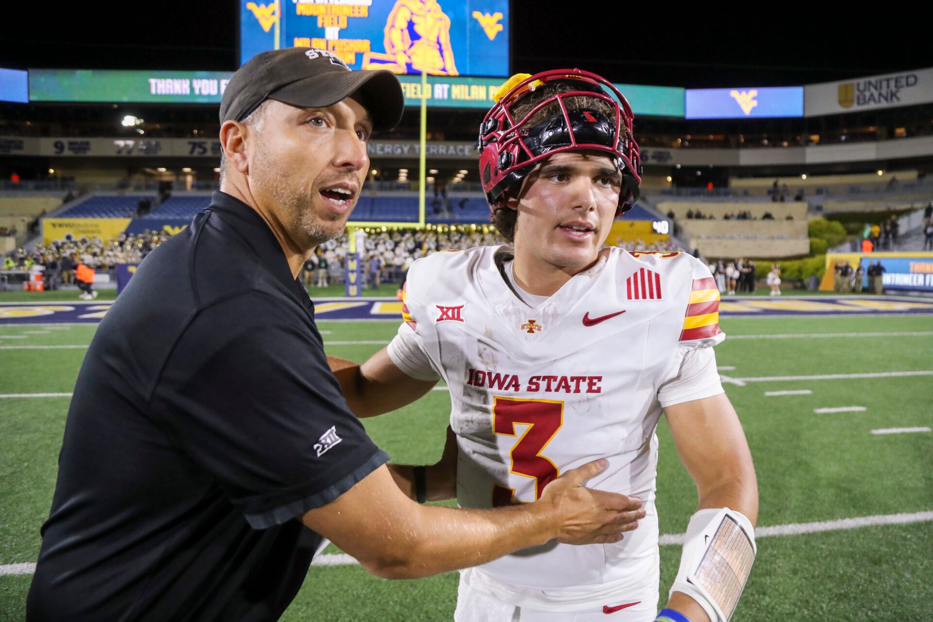 Iowa State Cyclones head coach Matt Campbell celebrates with quarterback Rocco Becht (3) after defeating the West Virginia Mountaineers at Mountaineer Field at Milan Puskar Stadium.