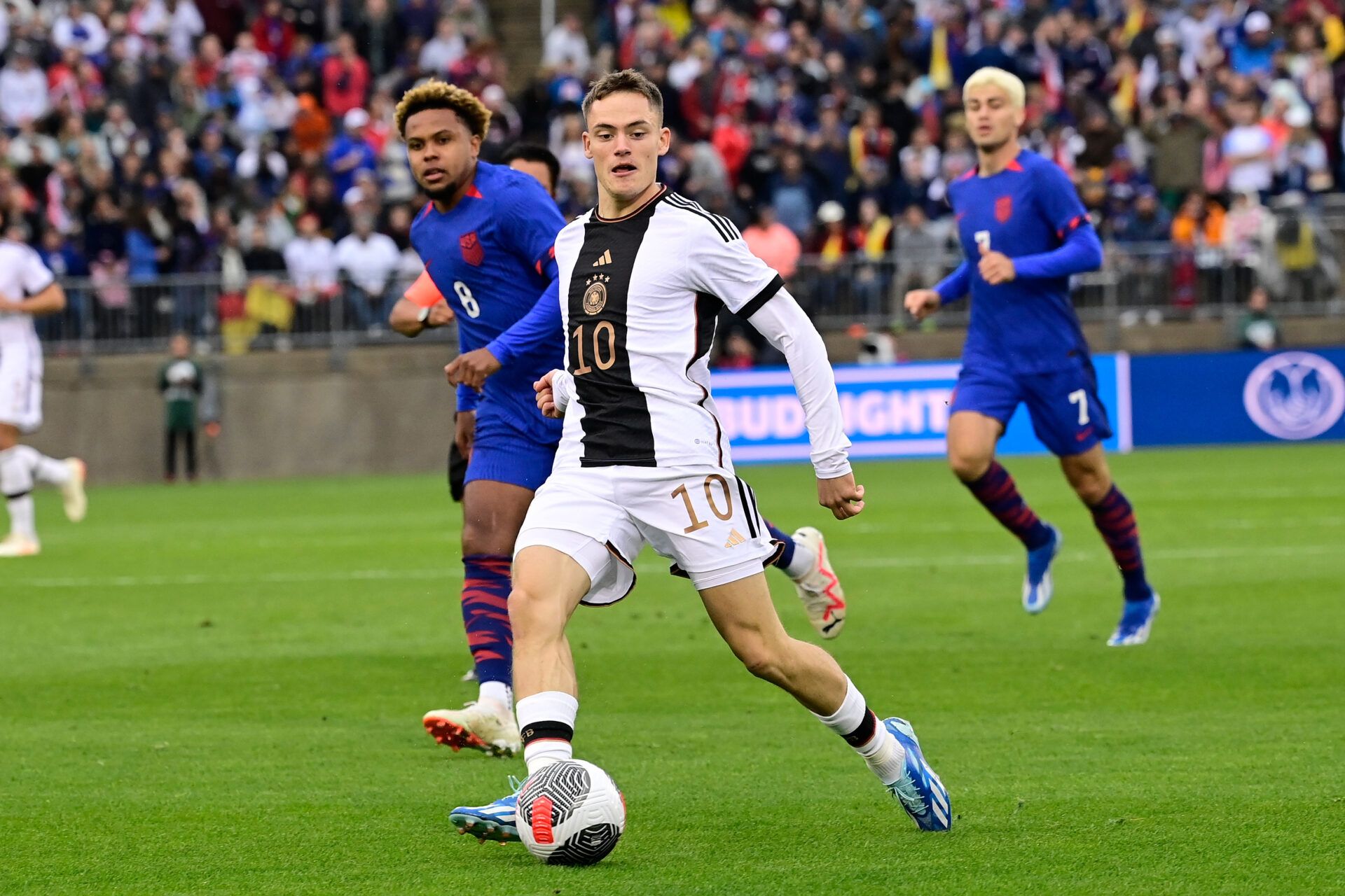 Germany midfielder Florian Wirtz (10) passes the ball against the United States men's national team during the first half at Pratt & Whitney Stadium.