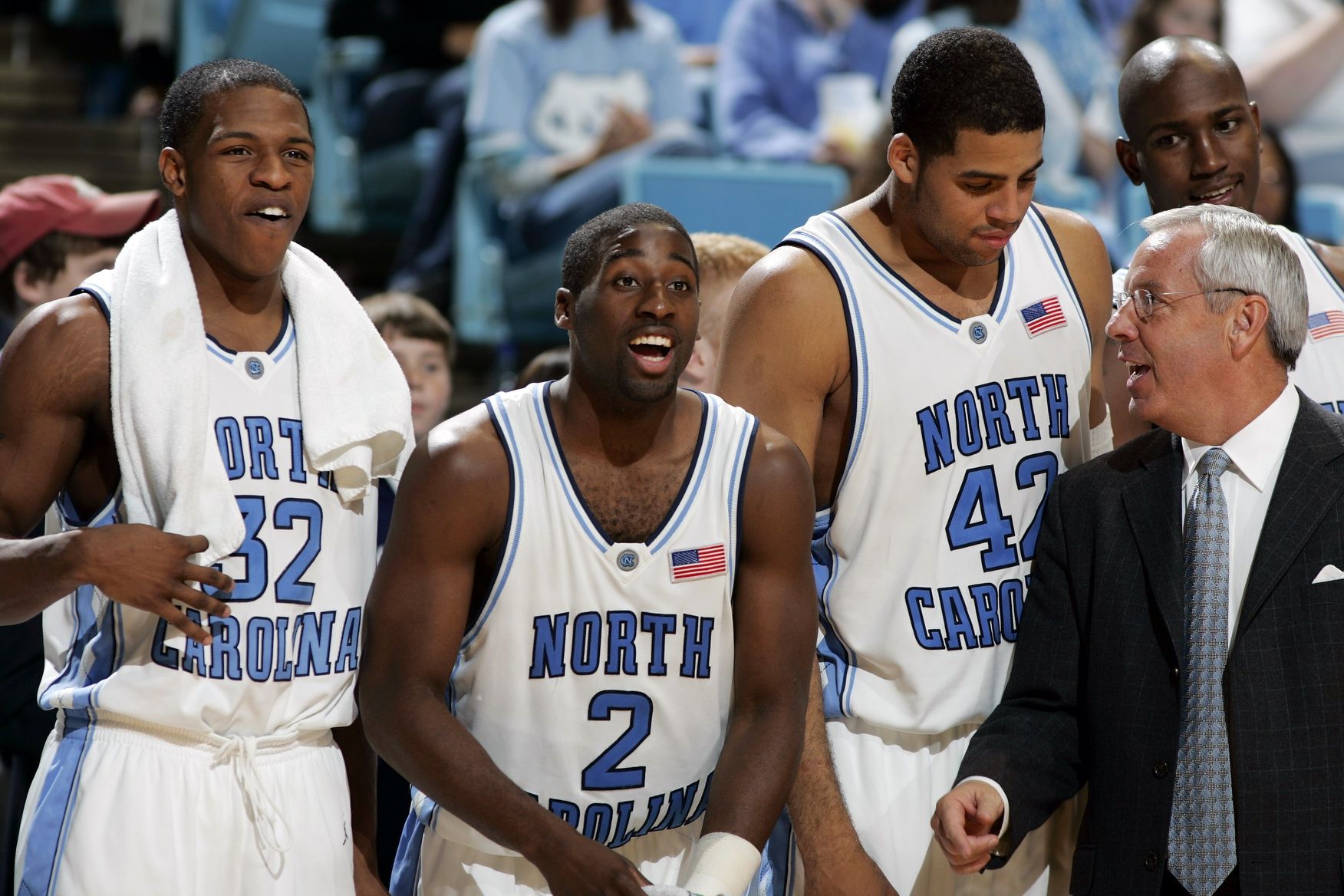 From left to right, UNC's Rashad McCants, Raymond Felton, Sean May and coach Roy Williams cheer on the subs in UNC's 109-60 victory over Loyola.