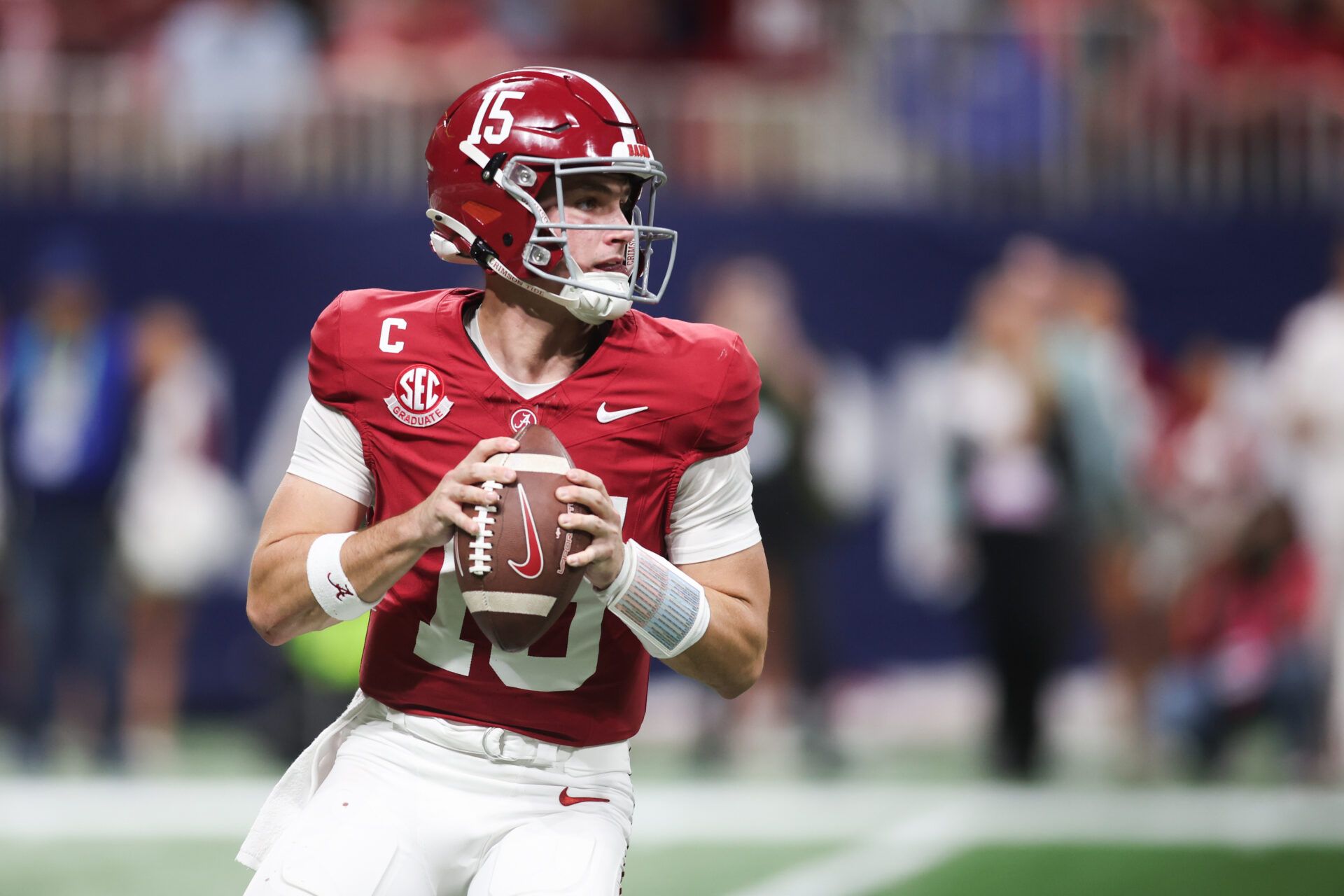 Alabama Crimson Tide quarterback Ty Simpson (15) looks to pass during the fourth quarter against the Georgia Bulldogs during the 2025 SEC Championship game at Mercedes-Benz Stadium.