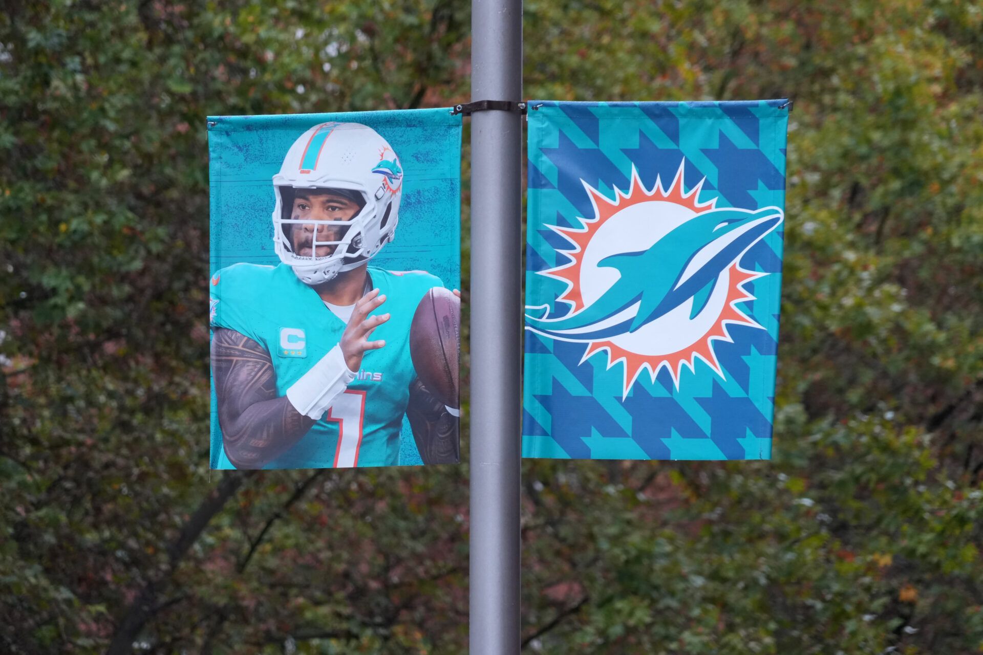 Street banners with the Miami Dolphins logo and image of Miami Dolphins quarterback Tua Tagovailoa (1) at Bernabeu Stadium, the site of the 2025 NFL Madrid Game between the Washington Commanders and the Dolphins.