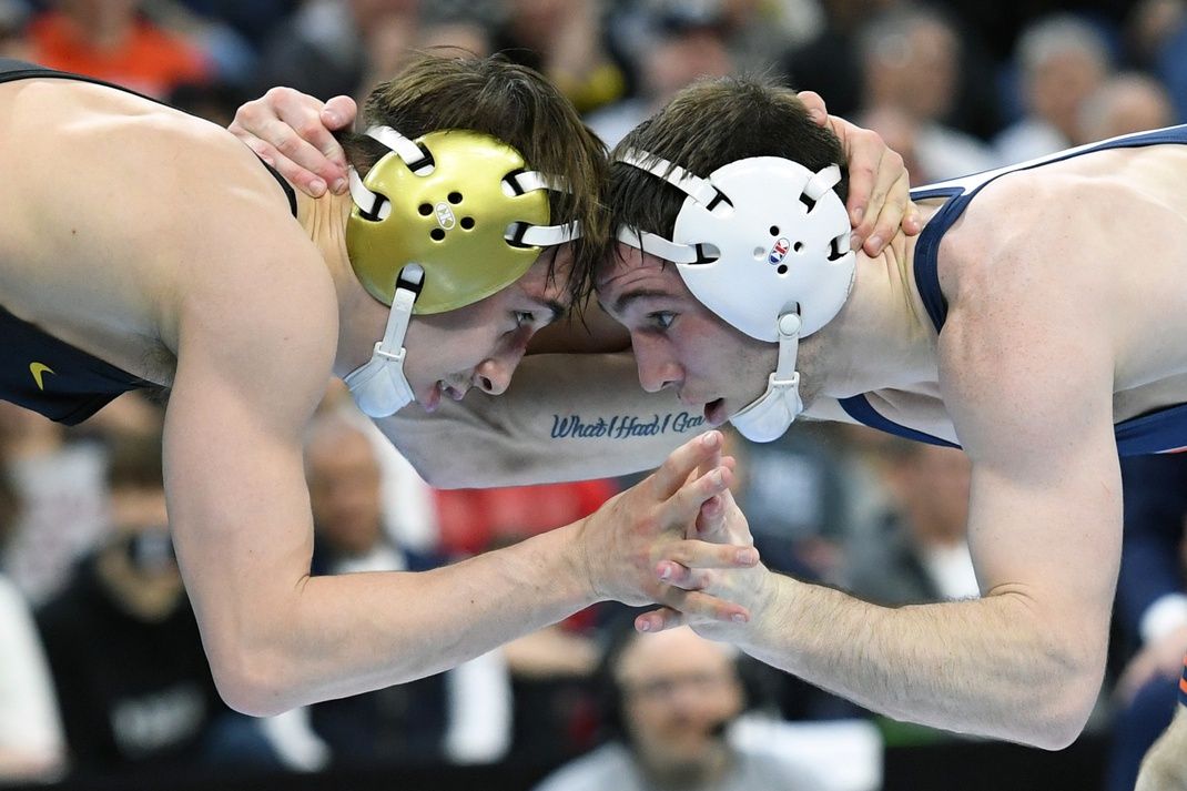 Drake Ayala of the Iowa Hawkeyes wrestles Lucas Byrd of the Illinois Fighting Illini during the Division I Men's Wrestling Championship held at Wells Fargo Center.