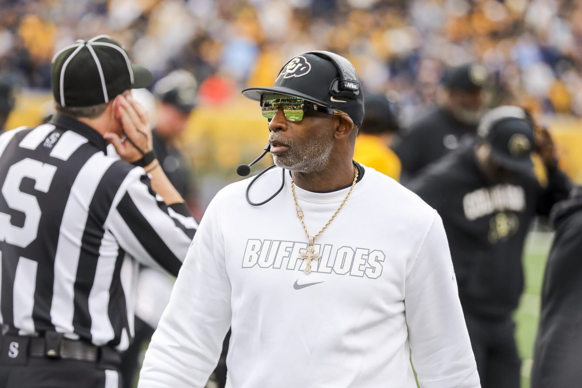 Colorado Buffaloes head coach Deion Sanders walks along the sidelines late in the fourth quarter against the West Virginia Mountaineers at Milan Puskar Stadium.