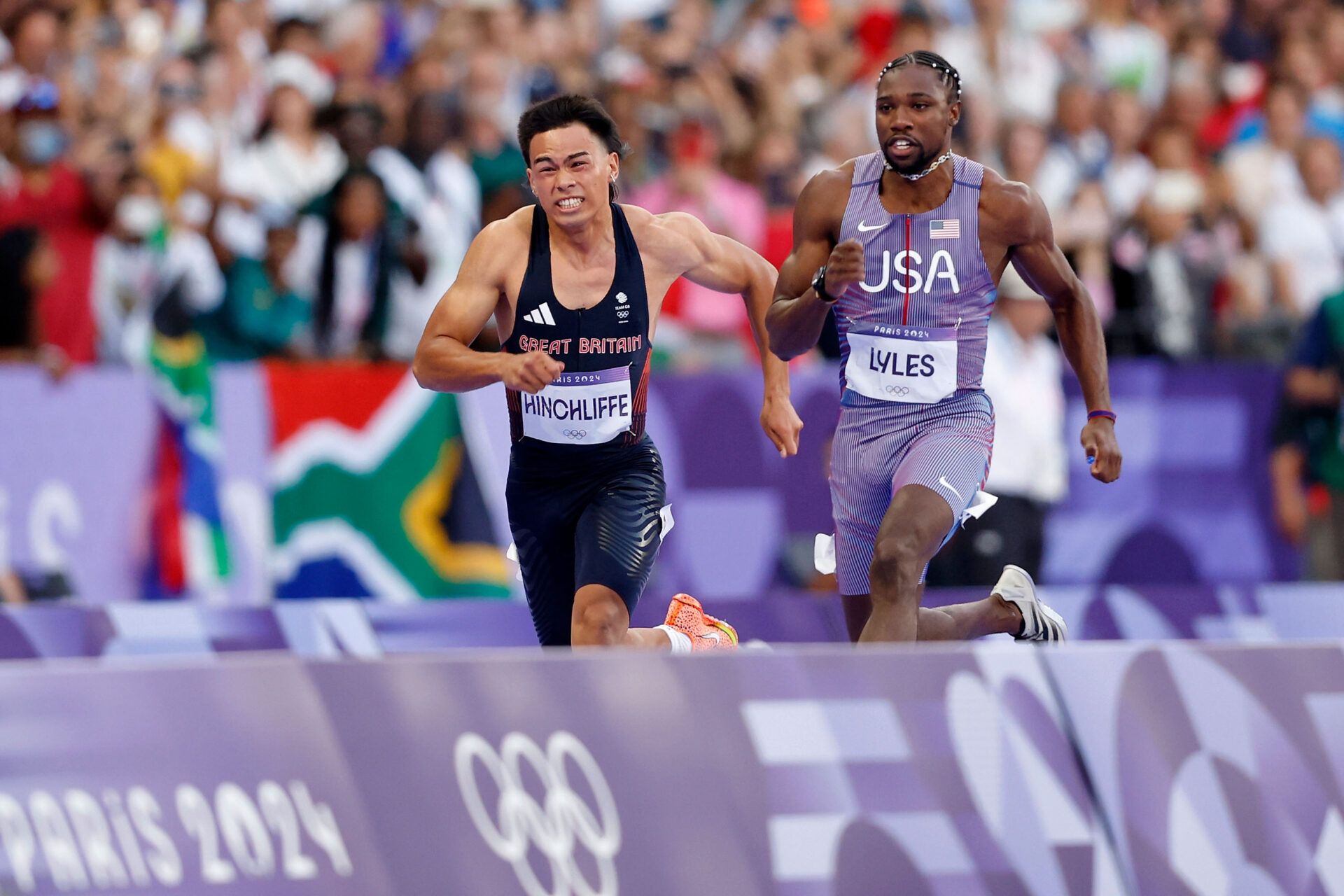 Louie Hinchliffe (GBR) and Noah Lyles (USA) compete in a mens 100m semifinal during the Paris 2024 Olympic Summer Games at Stade de France.