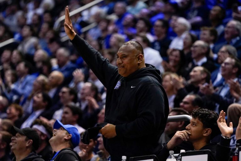 BYU Cougars football head coach Kalani Sitake salutes the crowd during second half of a game between the BYU Cougars and the UCF Knights at Marriott Center.