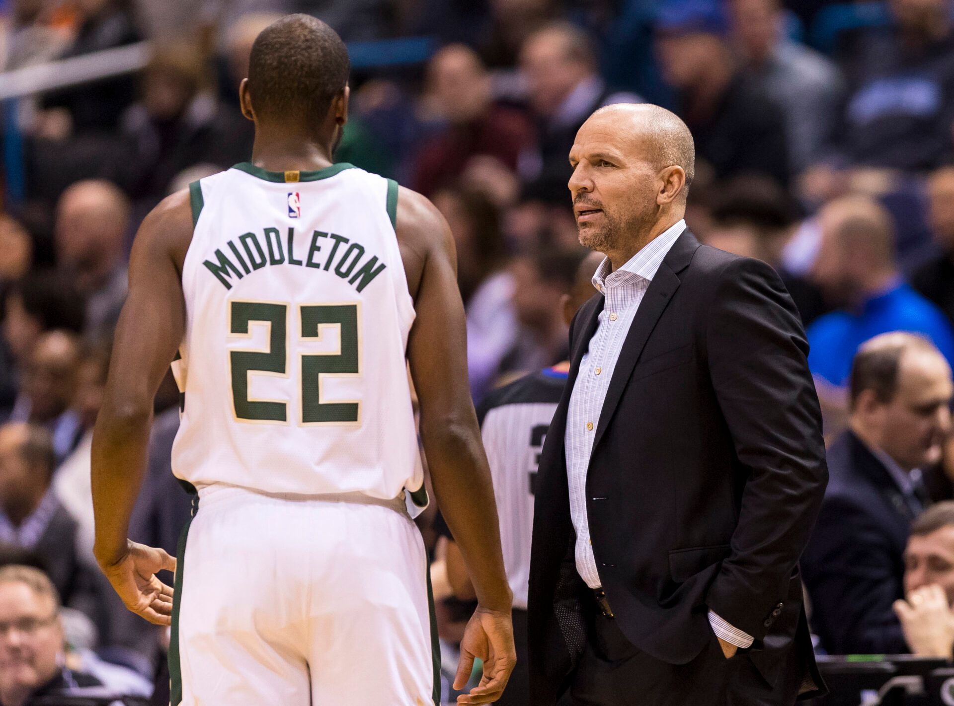 Milwaukee Bucks head coach Jason Kidd talks with forward Khris Middleton (22) during the first quarter against the Indiana Pacers at BMO Harris Bradley Center.