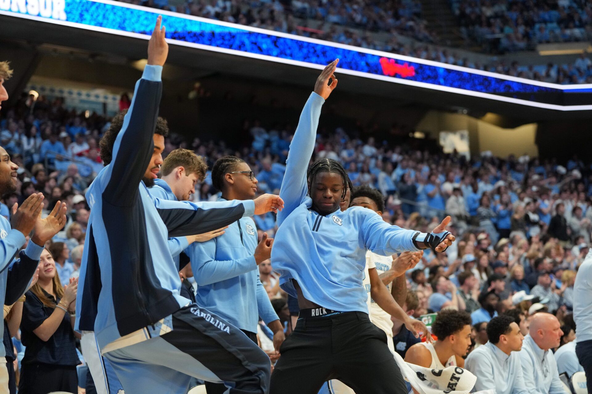North Carolina Tar Heels guard Isaiah Denis (5) and forward Caleb Wilson (8) react on the bench in the second half at Dean E. Smith Center.