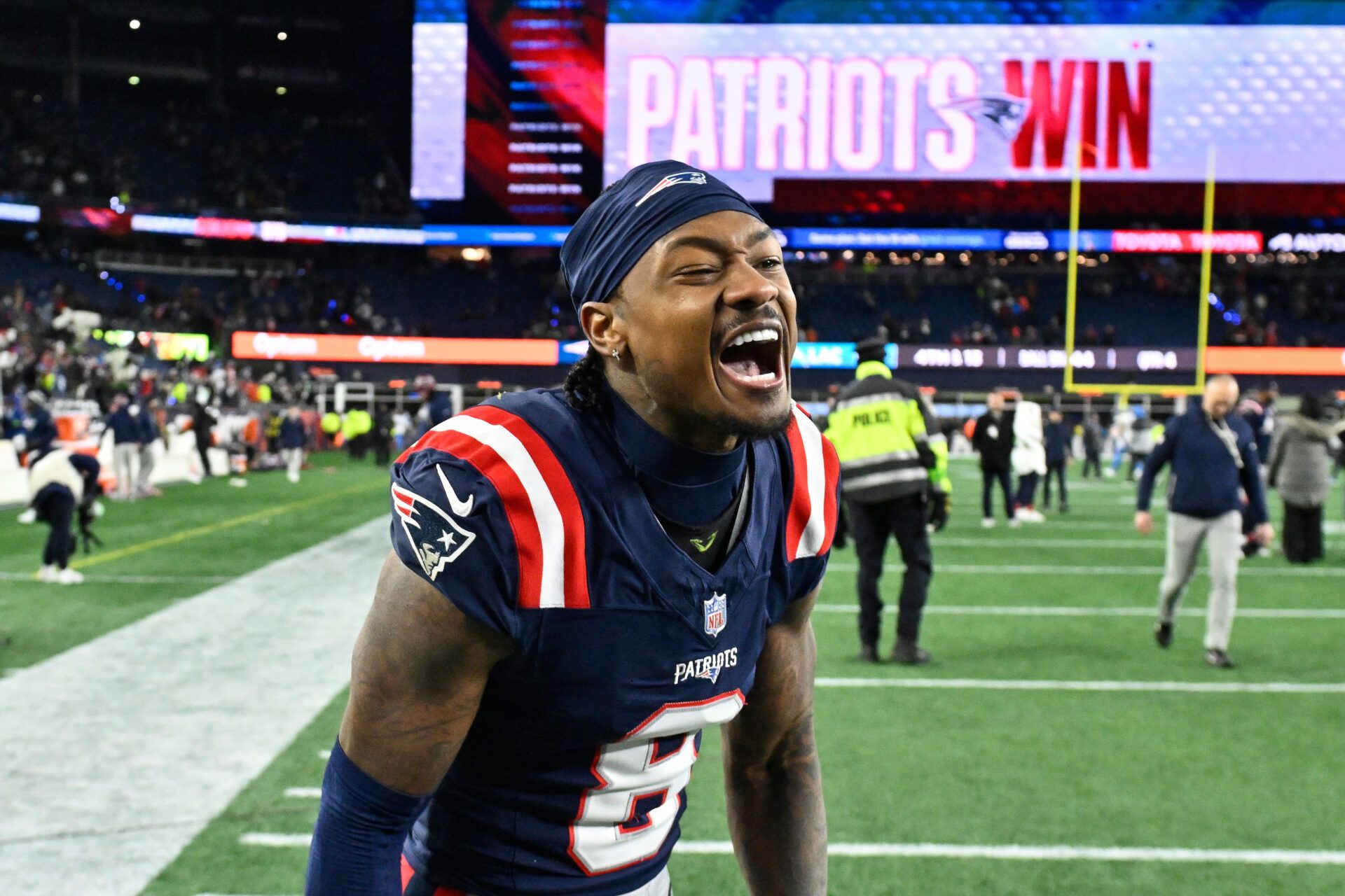 New England Patriots wide receiver Stefon Diggs (8) reacts after defeating the Los Angeles Chargers in an AFC Wild Card Round game at Gillette Stadium.