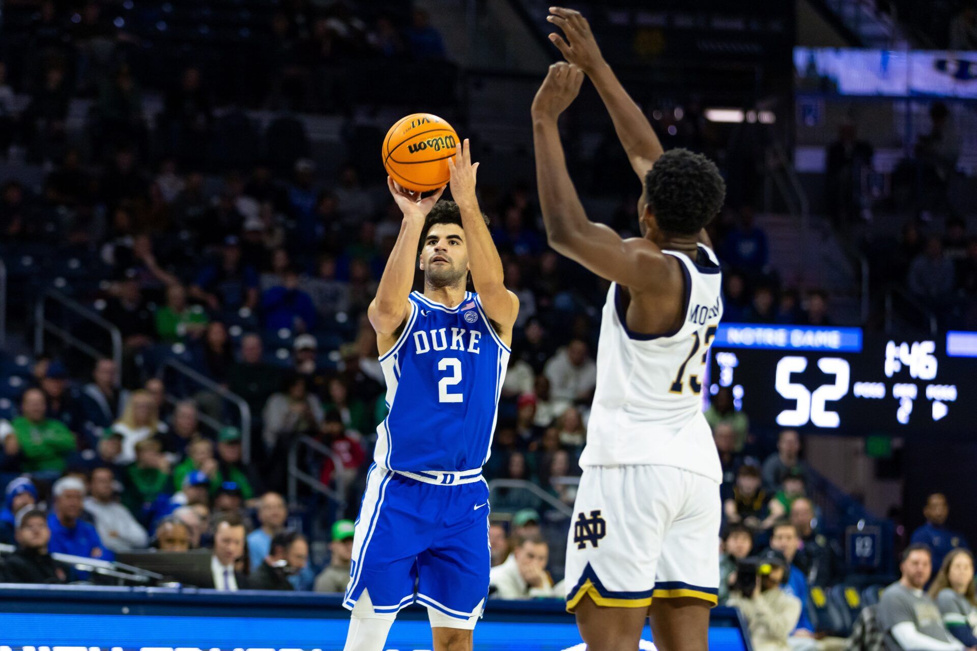 Duke Blue Devils guard Cayden Boozer (2) shoots as Notre Dame Fighting Irish guard Sir Mohammed (13) defends during the second half at Purcell Pavilion at the Joyce Center.