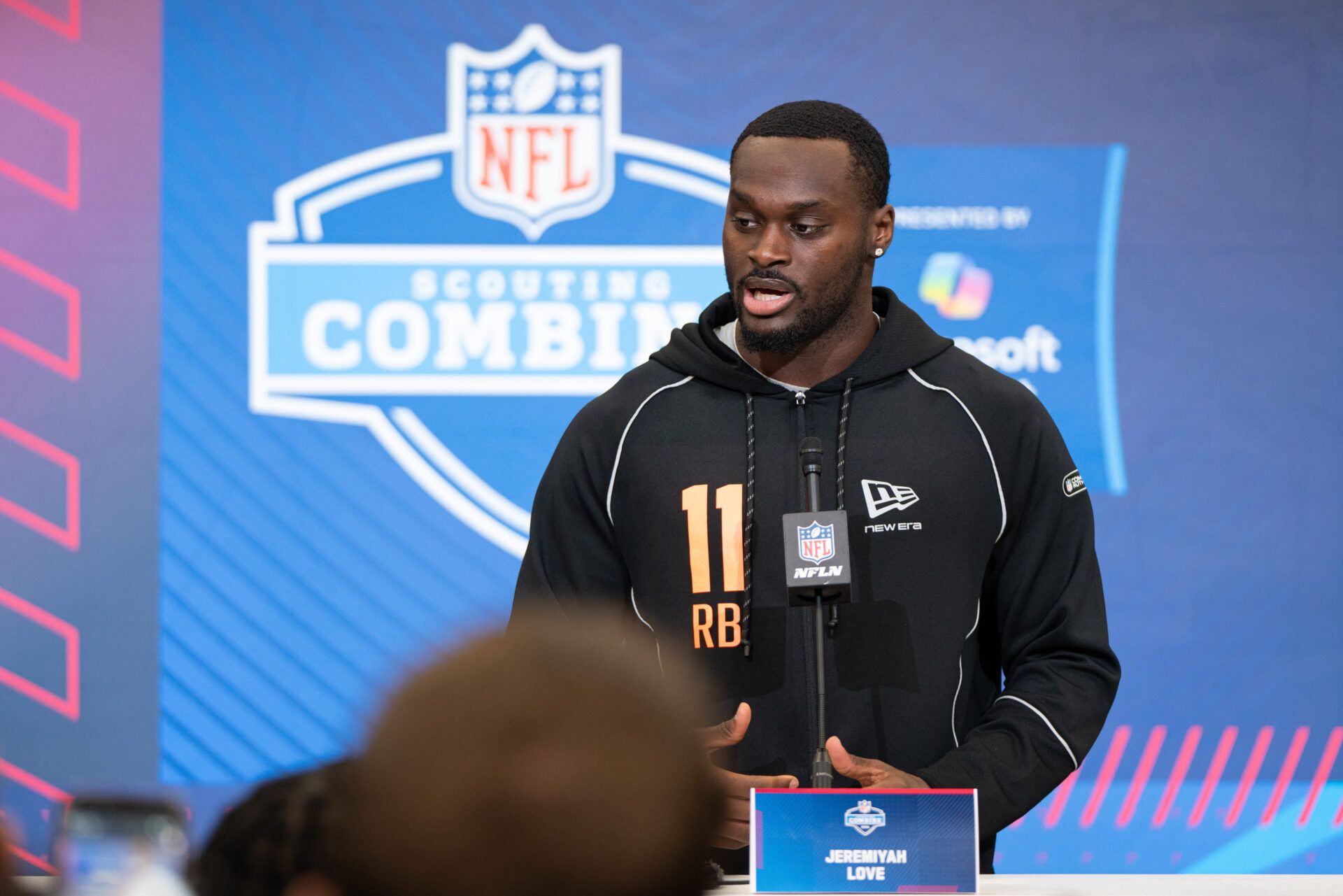 Notre Dame running back Jeremiyah Love (RB11) speaks to members of the media during the NFL Combine at the Indiana Convention Center.
