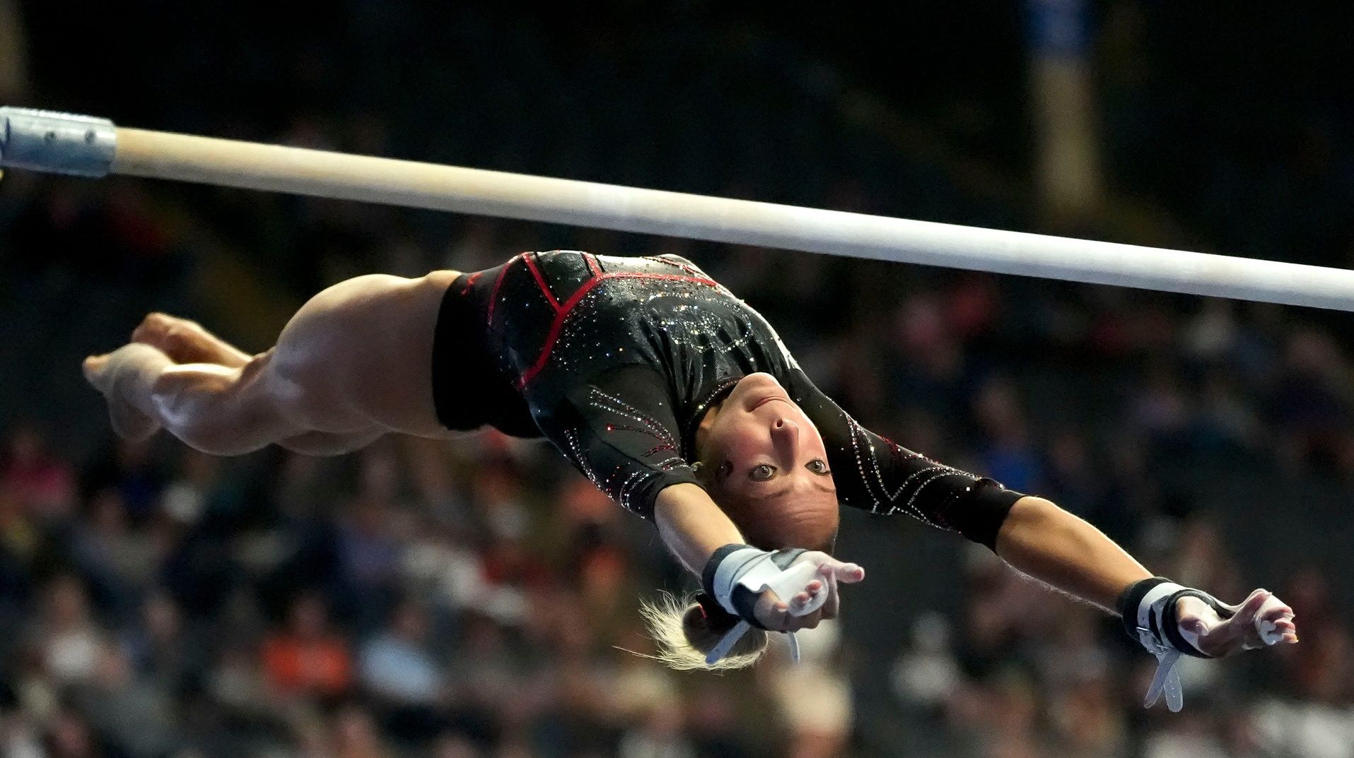 Georgia gymnast Lily Smith competes on the bars in Sesssion 1 of the SEC Gymnastics Tournament at Legacy Arena.