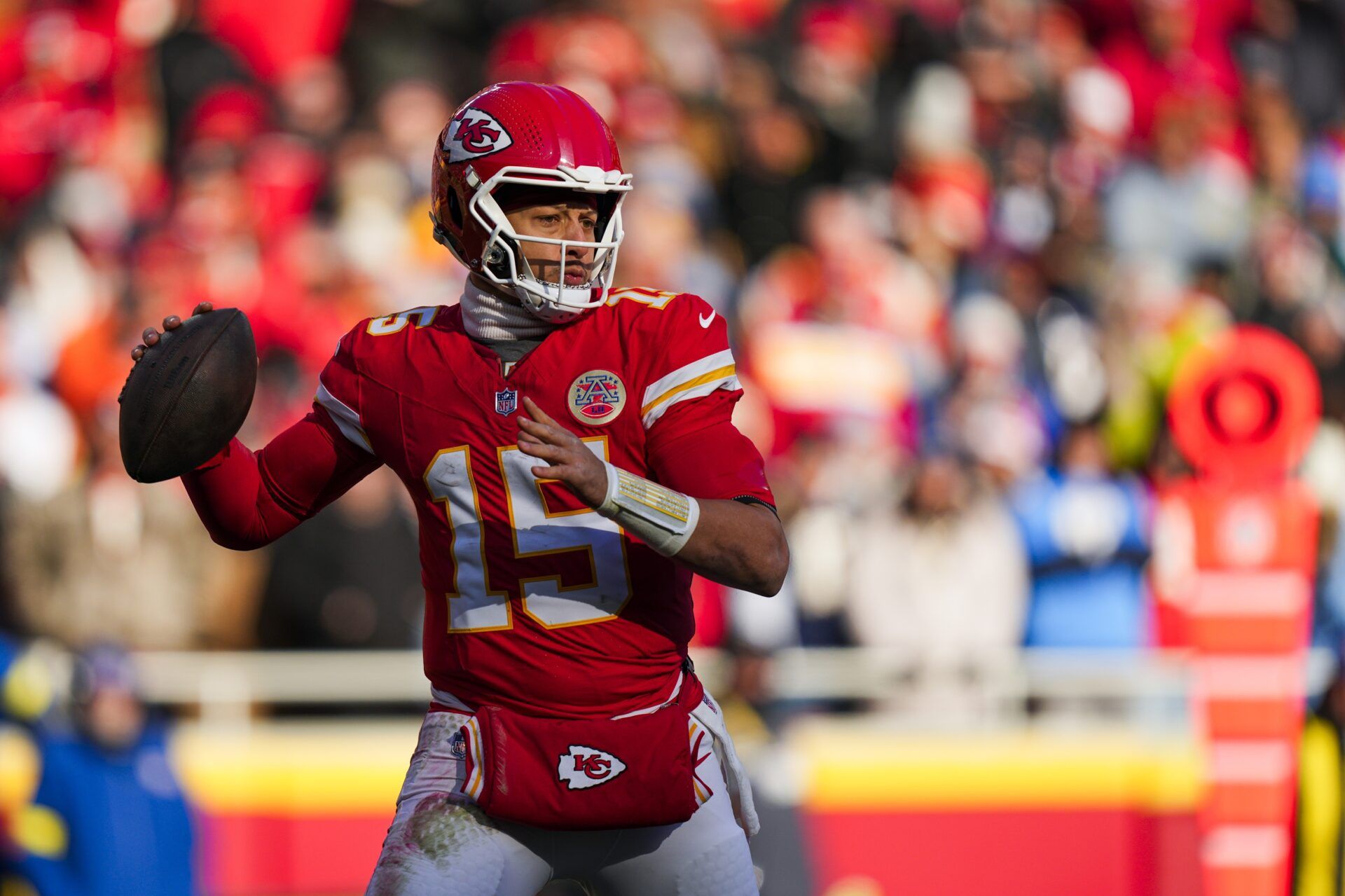 Kansas City Chiefs quarterback Patrick Mahomes (15) looks to pass against the Los Angeles Chargers during the second quarter at GEHA Field at Arrowhead Stadium.