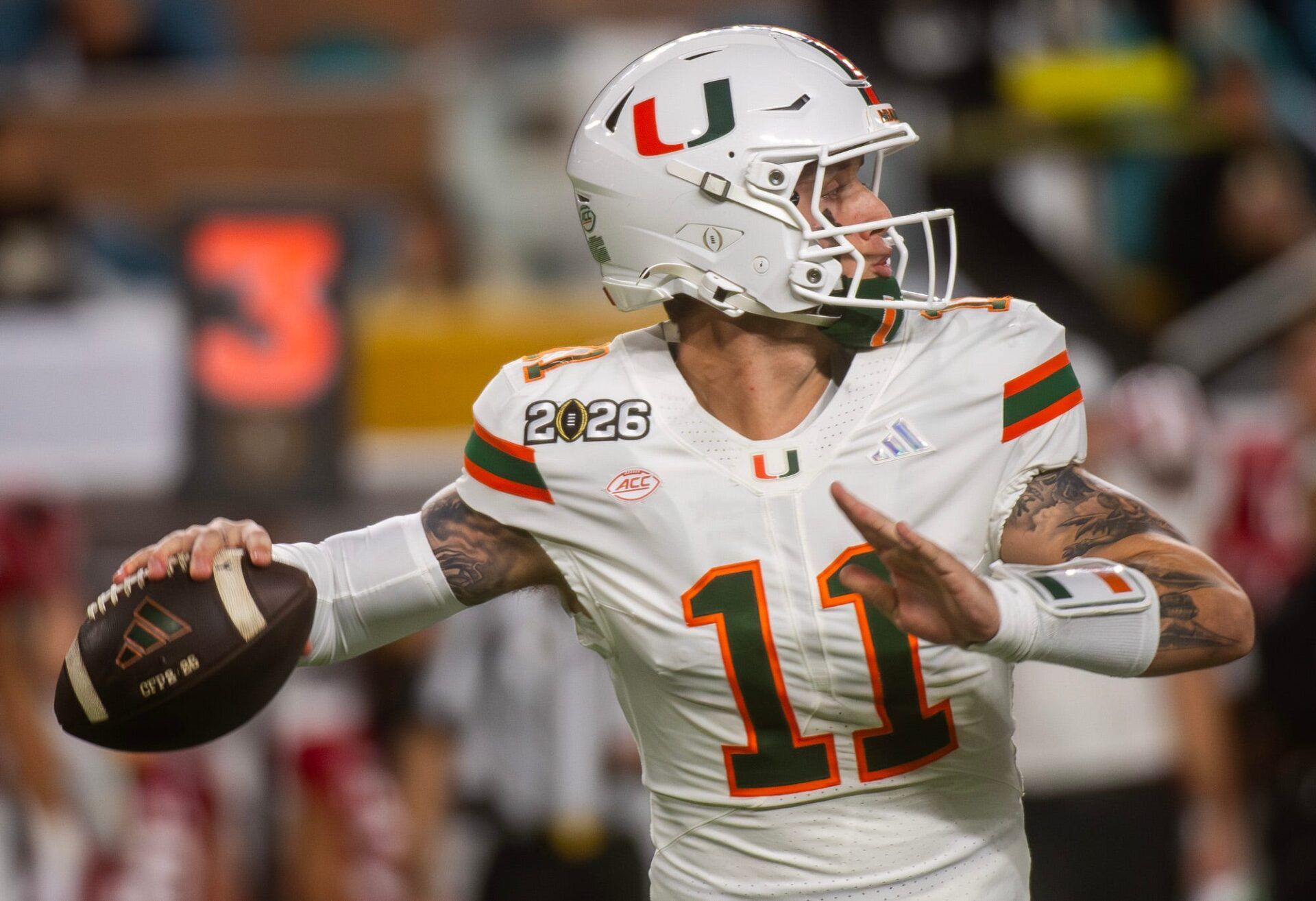 Miami's Carson Beck (11) throws during the College Football Playoff National Championship college football game at Hard Rock Stadium in Miami Gardens on Monday, Jan. 19, 2026.