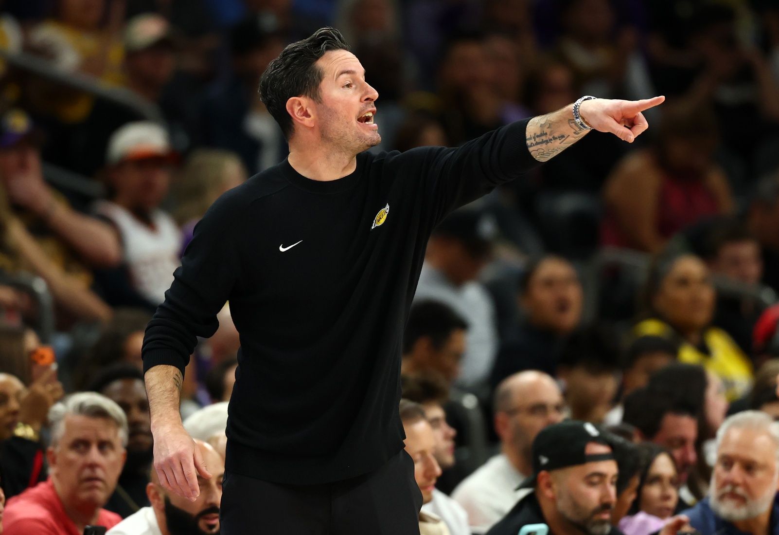 Los Angeles Lakers head coach JJ Redick reacts against the Phoenix Suns in the first half at Mortgage Matchup Center.
