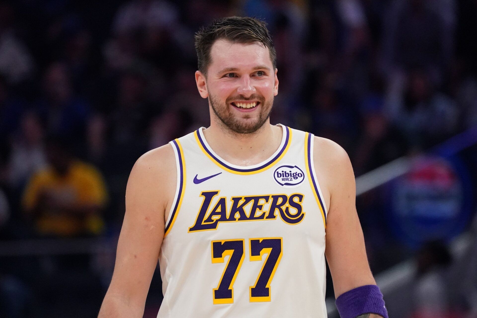 Los Angeles Lakers forward/guard Luka Doncic (77) smiles during a break in the action against the Golden State Warriors in the third period at Chase Center.