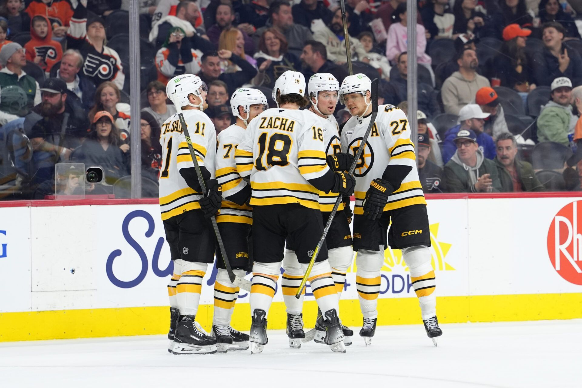Boston Bruins defenseman Charlie McAvoy (73) celebrates with teammates after scoring a goal against the Philadelphia Flyers in the third period at Xfinity Mobile Arena.