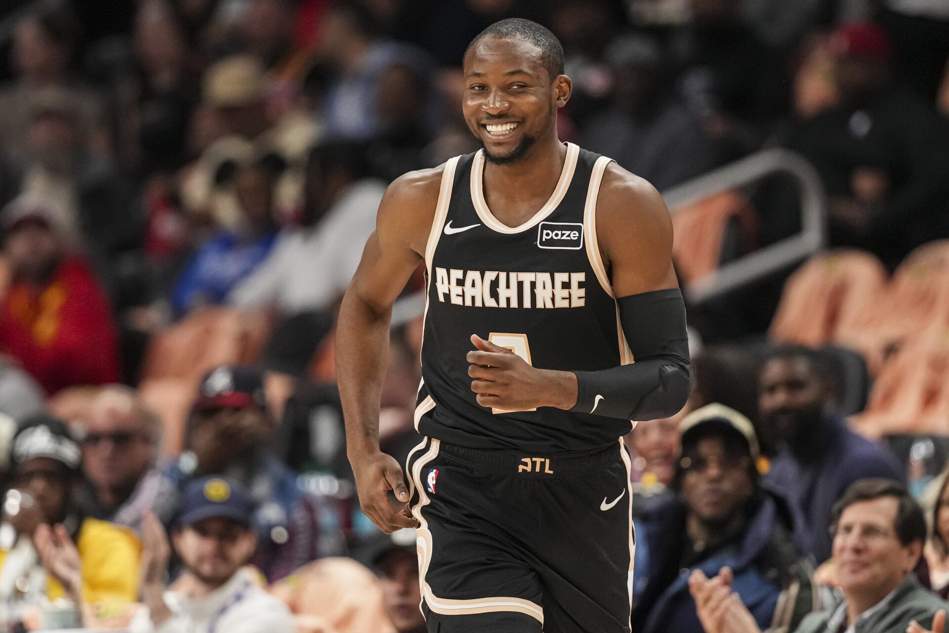 Atlanta Hawks forward Jonathan Kuminga (0) reacts after making a three point shot against the Washington Wizards during the first half at State Farm Arena.