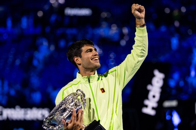 Carlos Alcaraz of Spain with the Norman Brookes Challenge Cup after his victory over Novak Djokovic of Serbia in the final of the mens singles at the Australian Open at Rod Laver Arena in Melbourne Park.