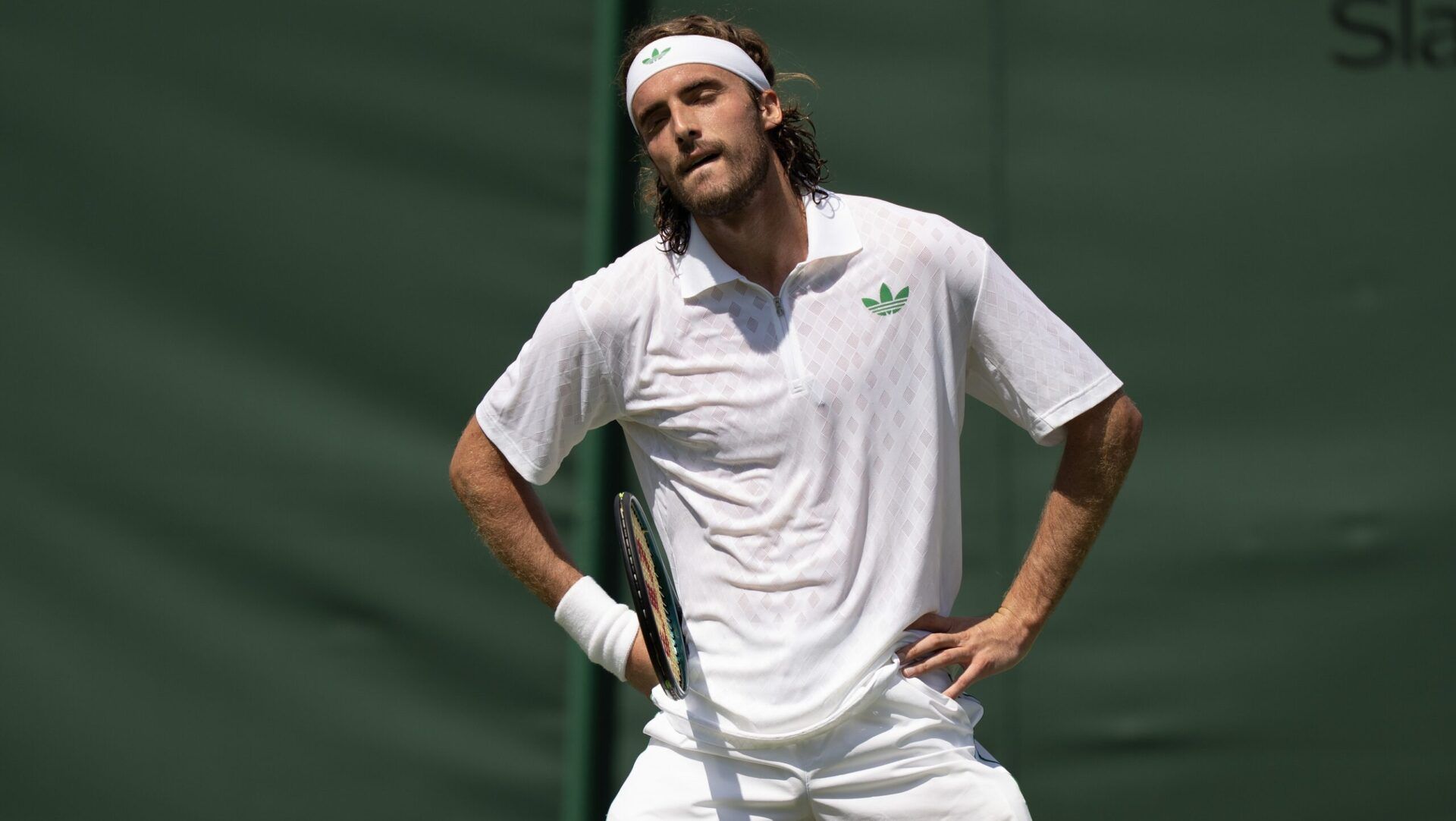 Stefanos Tsitsipas of Greece reacts to a point during his match against Valentin Royer of France on day one at the All England Lawn Tennis and Croquet Club.