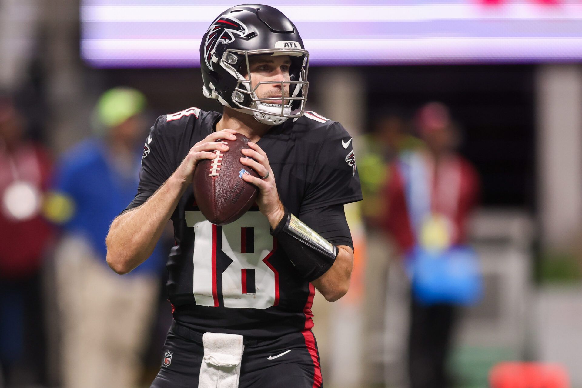 Atlanta Falcons quarterback Kirk Cousins (18) throws a pass against the New Orleans Saints in the first quarter at Mercedes-Benz Stadium.