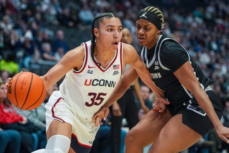 UConn Huskies guard Azzi Fudd (35) drives the ball against Georgetown Hoyas guard Destiny Agubata (4) in the first half at PeoplesBank Arena.
