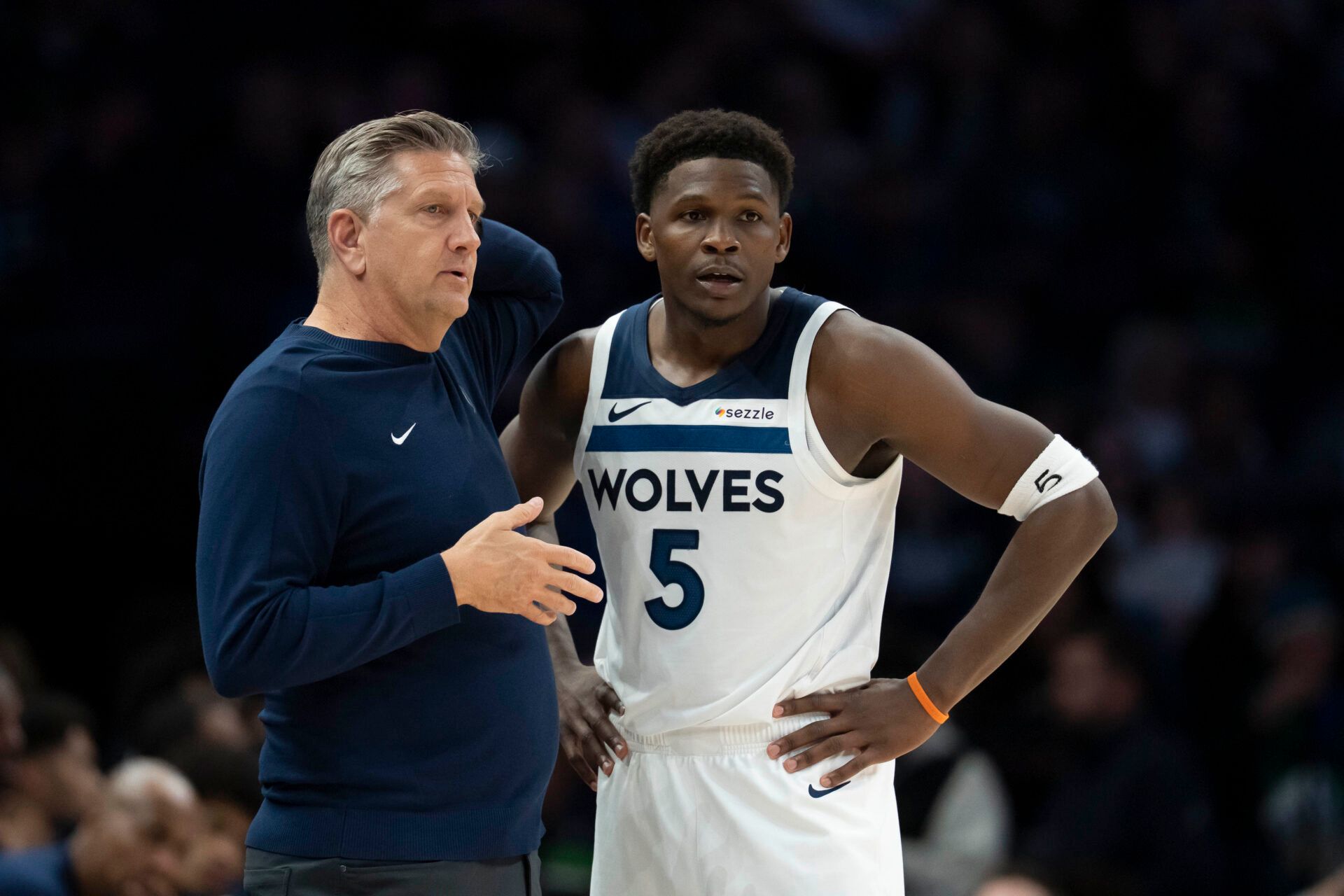 Minnesota Timberwolves head coach Chris Finch and Minnesota Timberwolves guard Anthony Edwards (5) looks on against the Dallas Mavericks in the second half at Target Center.