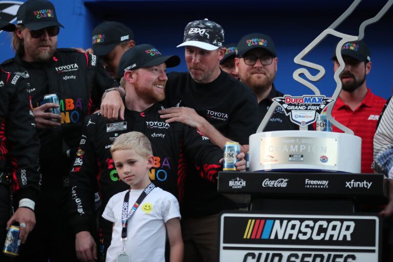 Car owner and NASCAR Cup Series driver Danny Hamlin (11) congratulates NASCAR Cup Series driver Tyler Reddick (45) for winning the NASCAR Cup Series Duramax Texas Grand Prix Powered by RelaDyne at Circuit of the Americas.