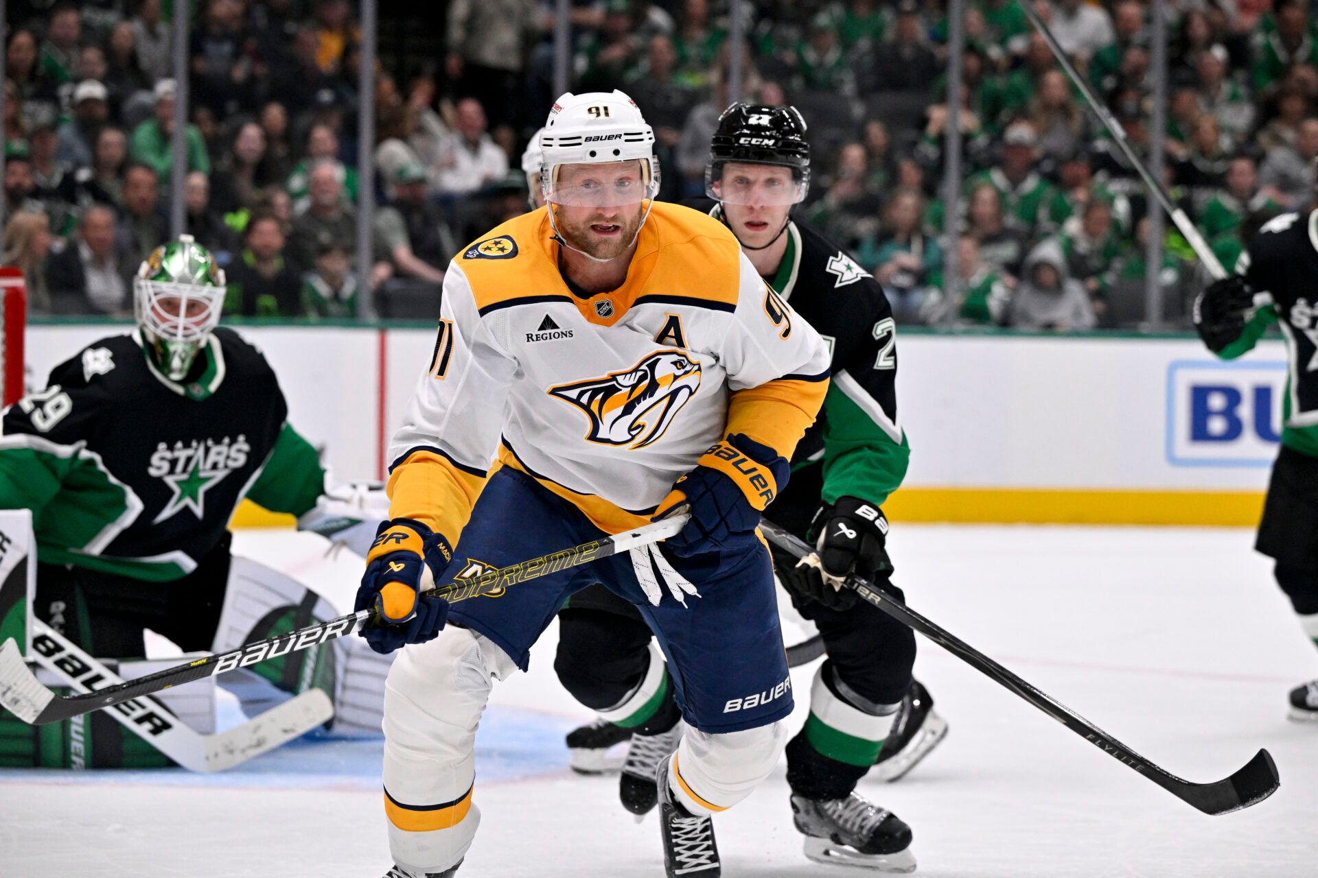 Nashville Predators center Steven Stamkos (91) and Dallas Stars defenseman Esa Lindell (23) chase the puck during the third period at the American Airlines Center.