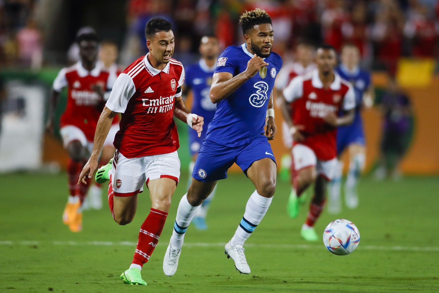 Arsenal forward Gabriel Martinelli (11) runs with the ball ahead of Chelsea defender Reece James (24) during the first half at Camping World Stadium.