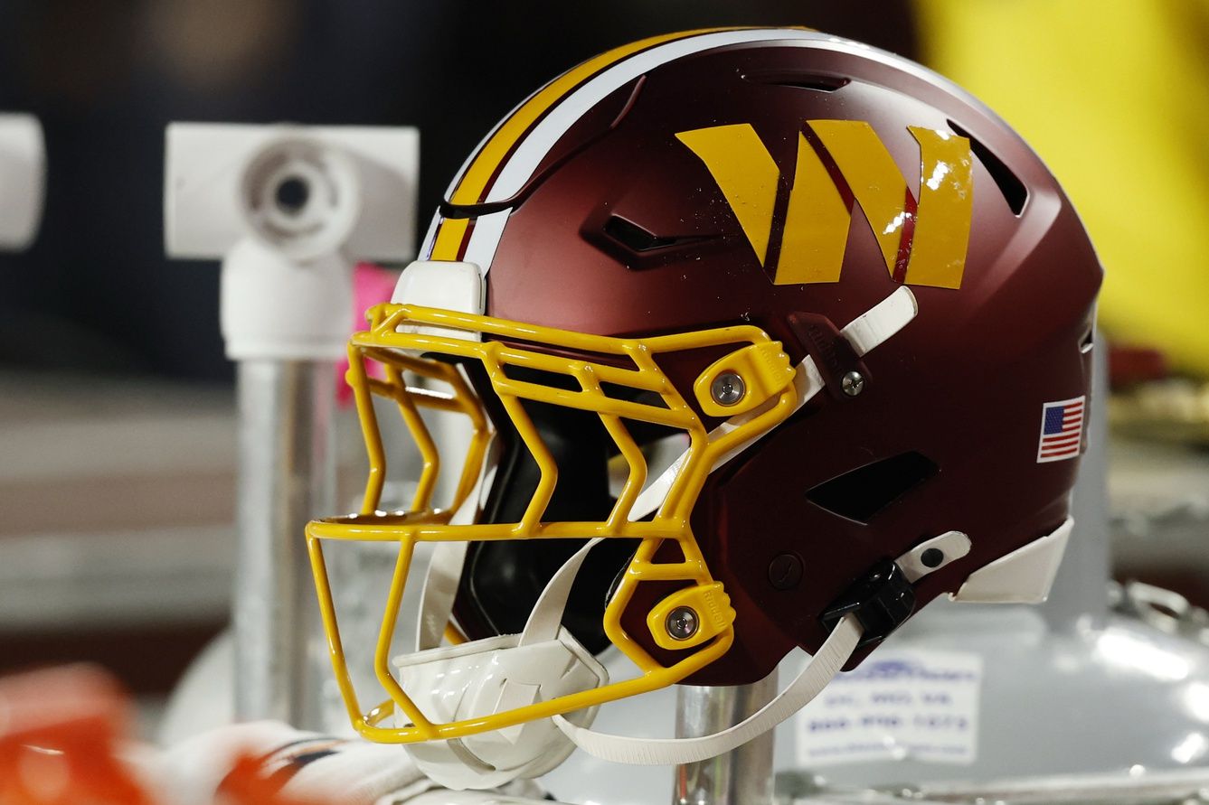 A Washington Commanders player's helmet on the bench during the game against the Seattle Seahawks at Northwest Stadium.