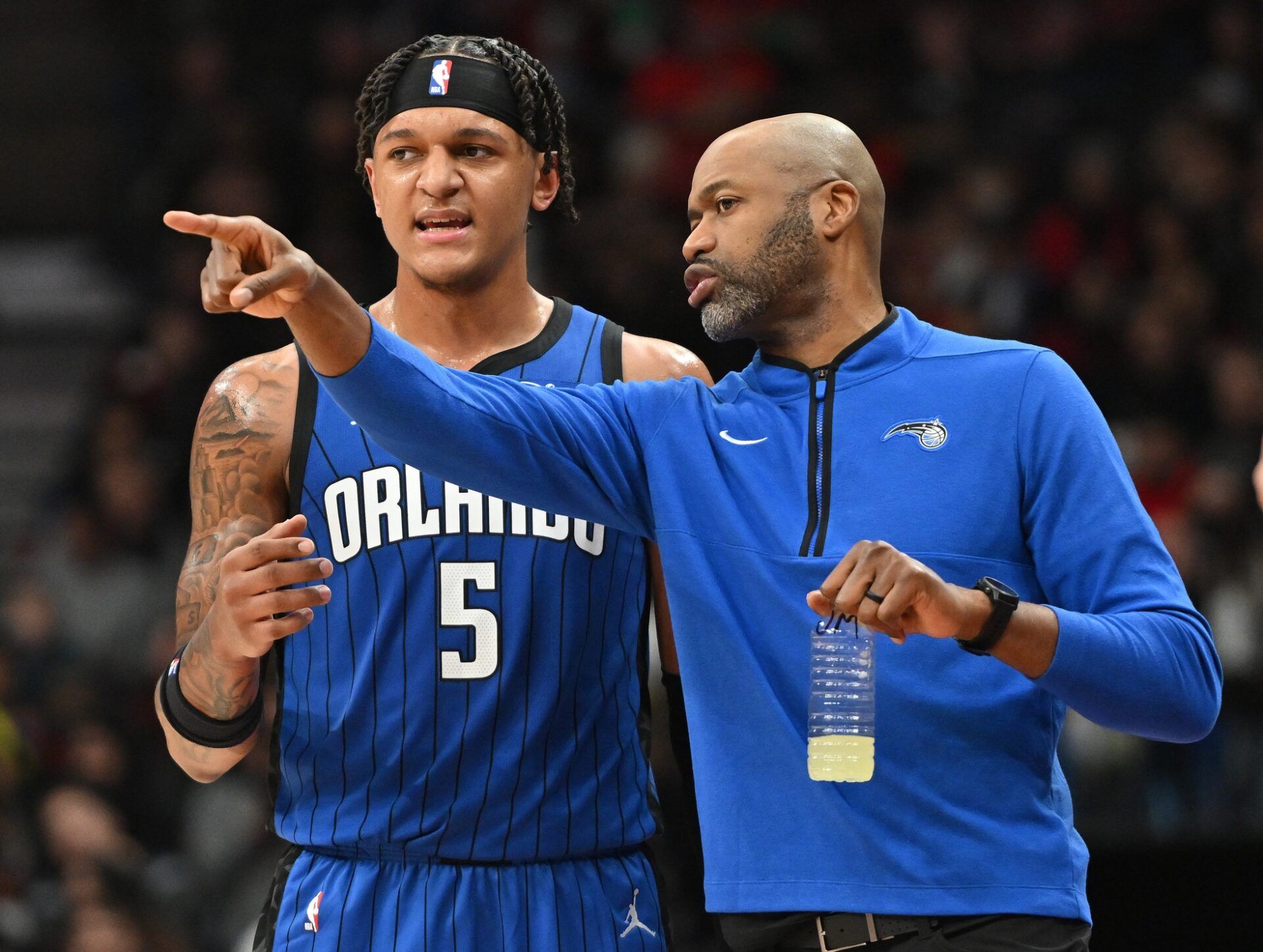 Orlando Magic head coach Jamahl Mosley speaks to forward Paolo Banchero (5) in the first half against the Toronto Raptors at Scotiabank Arena.