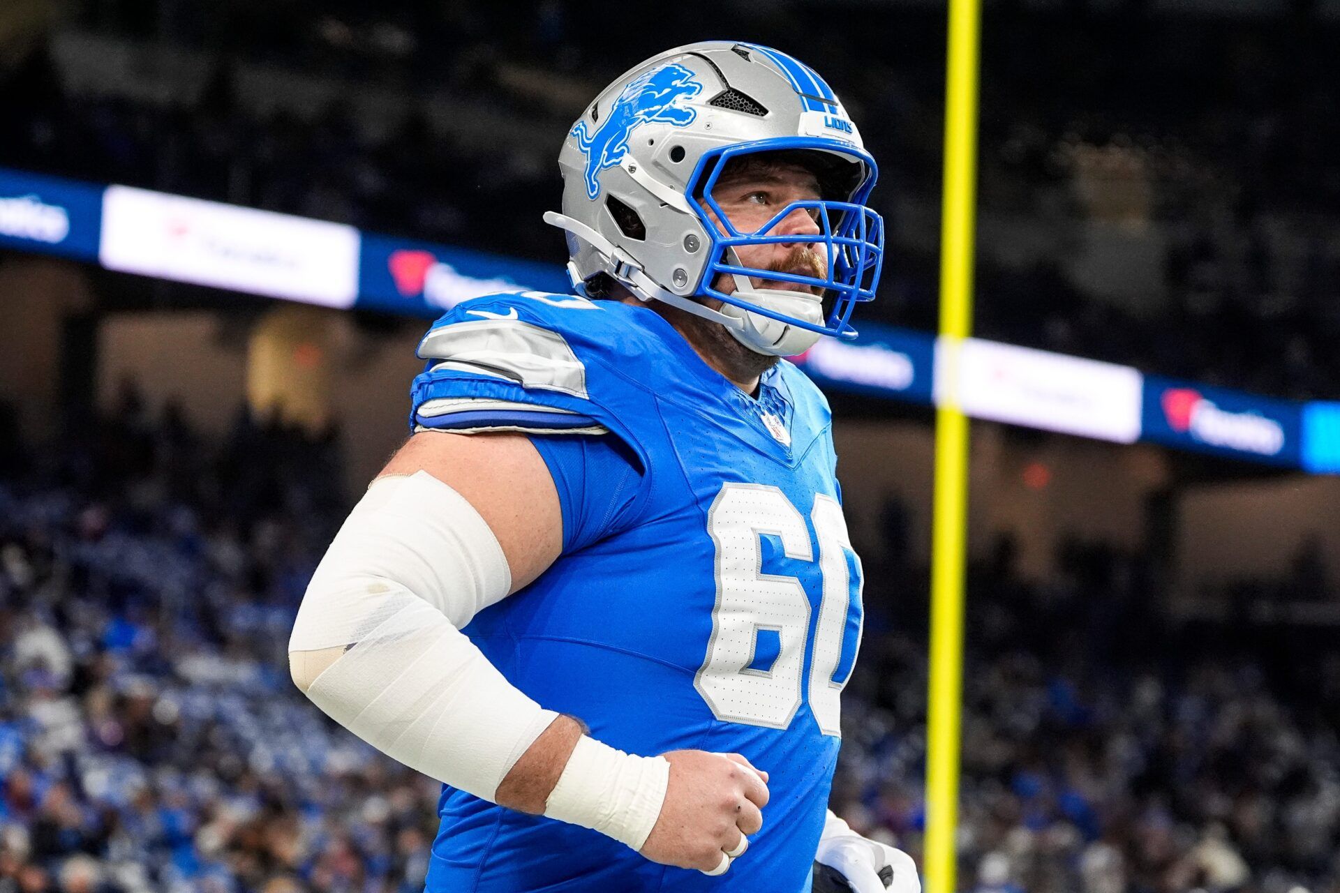 Detroit Lions guard Graham Glasgow (60) warms up ahead of the Minnesota Vikings game at Ford Field in Detroit on Sunday, November 2, 2025.
