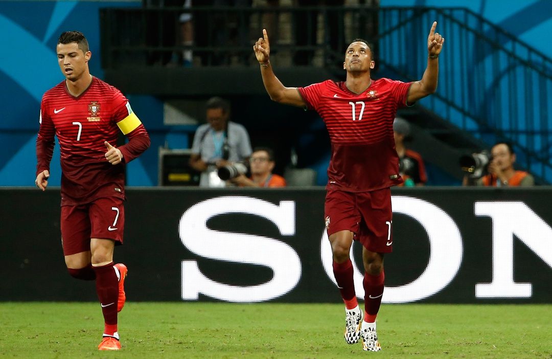 Portugal midfielder Nani (17) celebrates his goal as teammate forward Cristiano Ronaldo (7) against the United States during the first half of a 2014 World Cup game at Arena Amazonia.