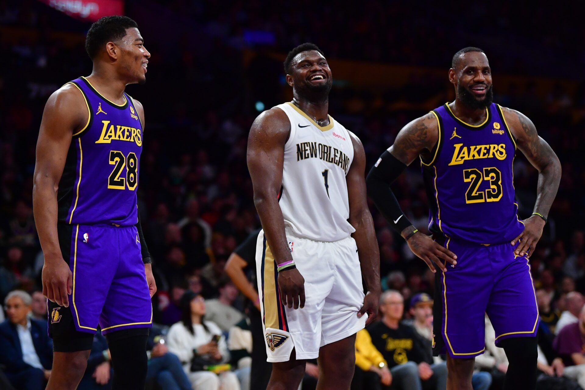 New Orleans Pelicans forward Zion Williamson (1) speaks with Los Angeles Lakers forward Rui Hachimura (28) and forward LeBron James (23) during the second half at Crypto.com Arena.