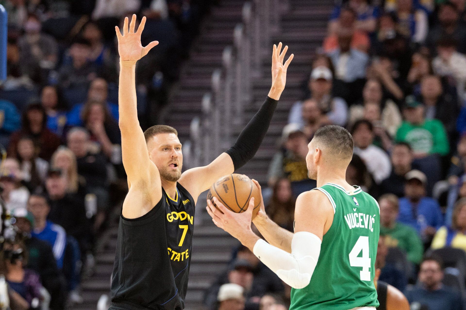 Golden State Warriors center Kristaps Porzingis (7) guards Boston Celtics center Nikola Vucevic (4) during the third quarter at Chase Center.