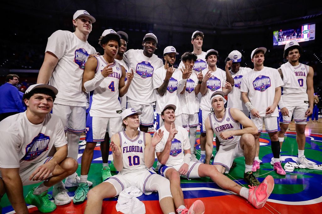 Florida Gators players pose for a team photo while celebrating the SEC regular season championship following the game against the Arkansas Razorbacks at Exactech Arena at the Stephen C. O'Connell Center.