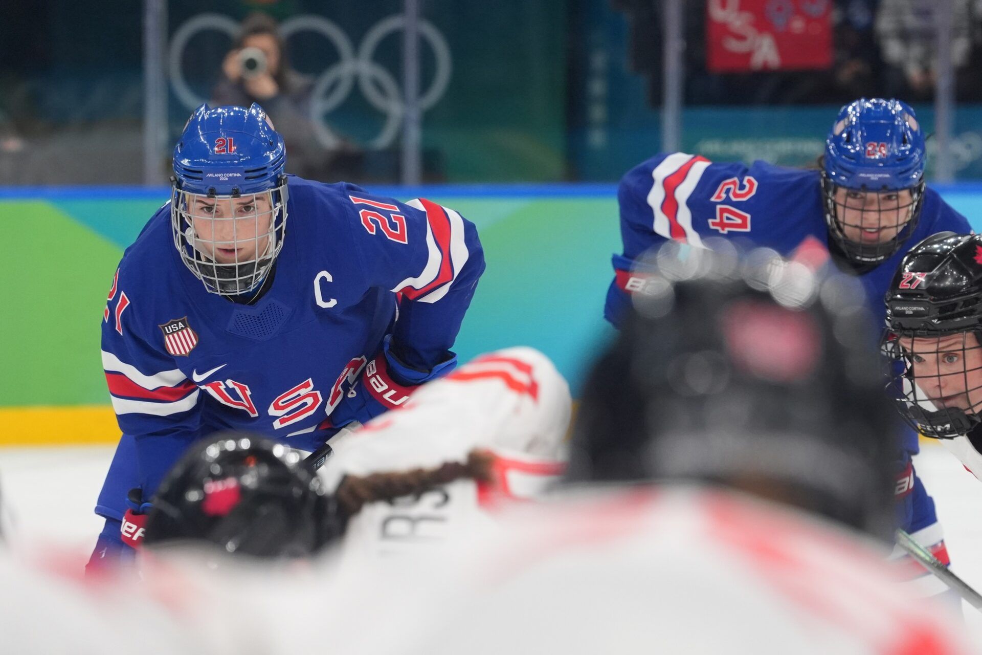 Hilary Knight (21) of the United States looks on during a face off in the women's ice hockey gold medal game against Canada during the Milano Cortina 2026 Olympic Winter Games at Milano Santagiulia Ice Hockey Arena.