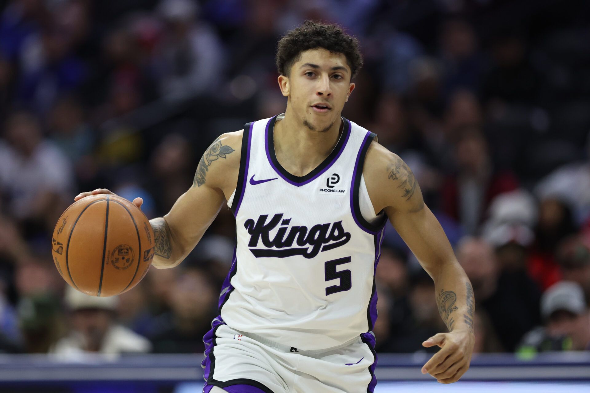 Sacramento Kings guard Nique Clifford (5) dribbles the ball against the Philadelphia 76ers during the first quarter at Xfinity Mobile Arena.