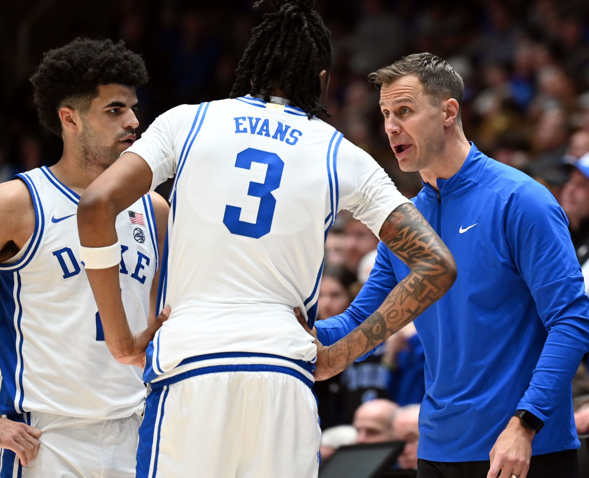 Duke Blue Devils head coach Jon Scheyer (right) talks to guards Cayden Boozer (2) and Isaiah Evans (3) during the second half against the Georgia Tech Yellow Jackets at Cameron Indoor Stadium.   The Blue Devils won 85-79.