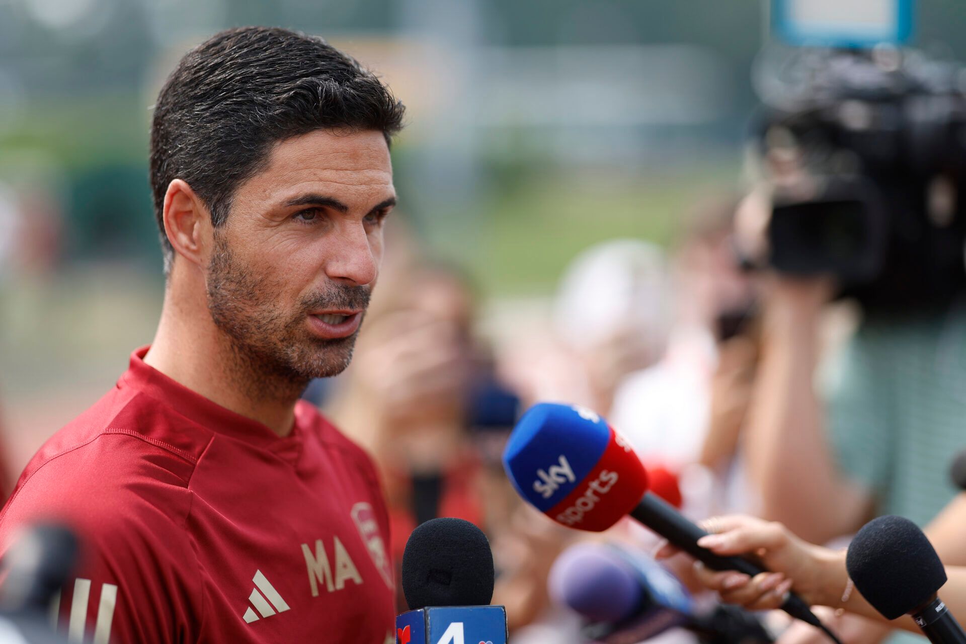 Arsenal manager Mikel Arteta (L) speaks with the media prior to an Arsenal training session at George Mason University Field House in preparation for the 2023 MLS All Star Game.