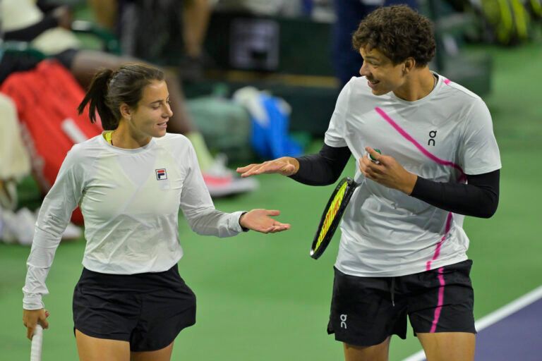 Emma Navarro and Ben Shelton celebrate after winning a point in the Eisenhower Cup Tie Break Tens event featuring mixed doubles during the BNP Paribas Open at the Indian Wells Tennis Garden.
