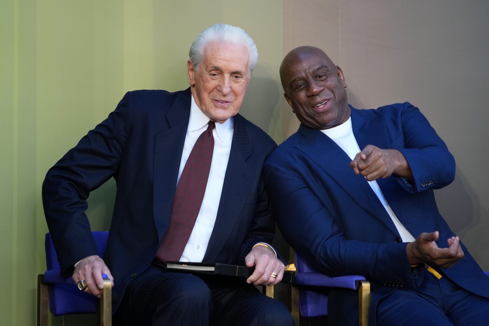 Los Angeles Lakers former coach Pat Riley (left) and Magic Johnson at statue unveiling of Riley at the Crypto.com Arena.